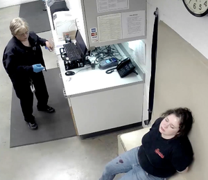 Adacia Chambers waits in the Stillwater Police Department booking area on Oct. 24 less than two hours after a car, reportedly, driven by her crashed into crowds of people at the OSU Homecoming parade. (photo taken from a booking video provided by the Stillwater Police Department.)